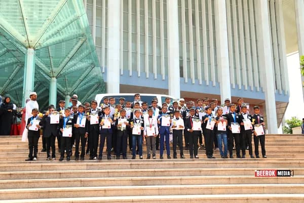 Boy awardees with their certificates on the BMICH steps