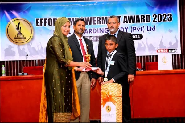 A student receiving an award on stage