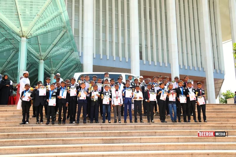 Boy awardees with their certificates on the BMICH steps