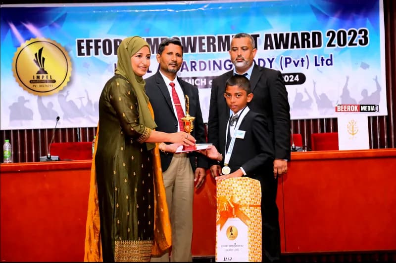 A student receiving an award on stage